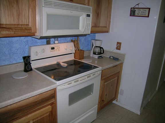 Newer kitchen  with white appliances