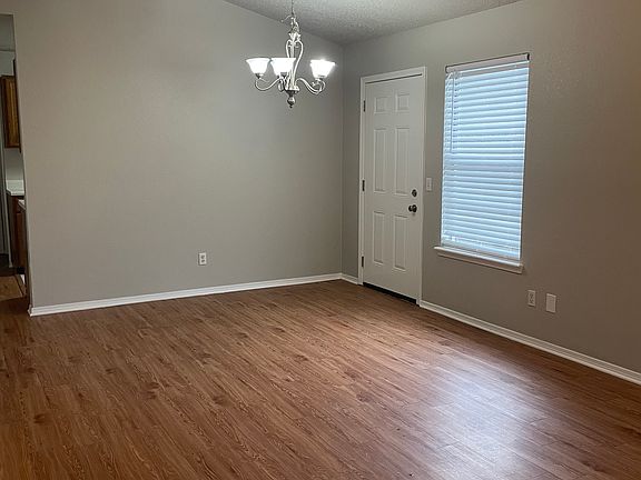 View of Living Room and Dining area from front door