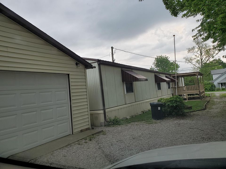 Front of moble home with nice 2 car garage.