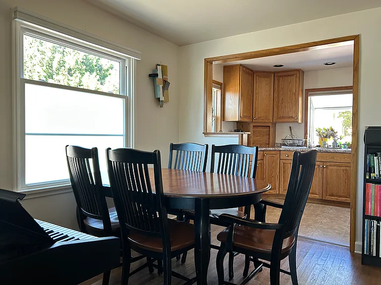 The dining area opens to the kitchen.