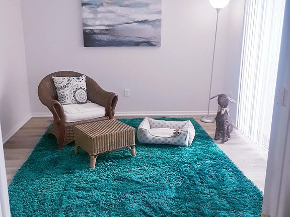 3rd bedroom/flex room with sliding door to patio