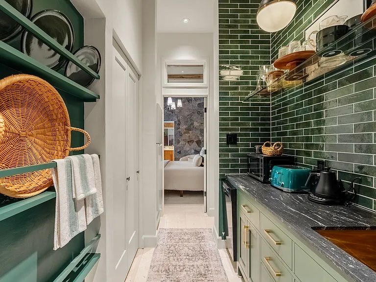 breezeway/kitchenette in lower level connecting two en suite bedrooms