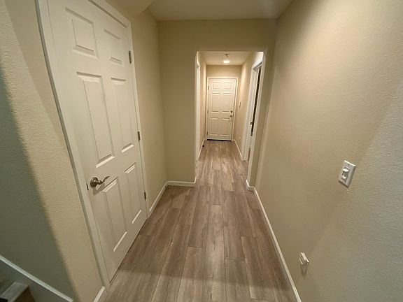 Entry Hall with large closet, Bedroom and full bath on this level and access to 2 Car garage.
