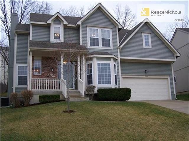 This is the home before the beautiful trees matured!