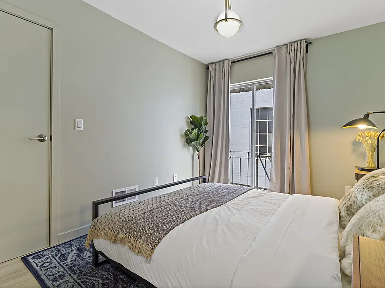 Bedroom 4 with small balcony