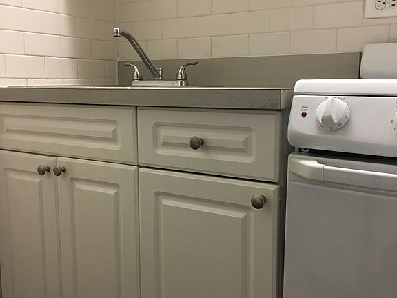 Fireplace unit has maple kitchen