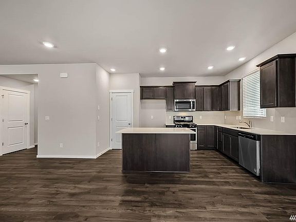 Brand new kitchen with center island for additional storage and counter space. Stainless refrigerator will be provided before move-in.