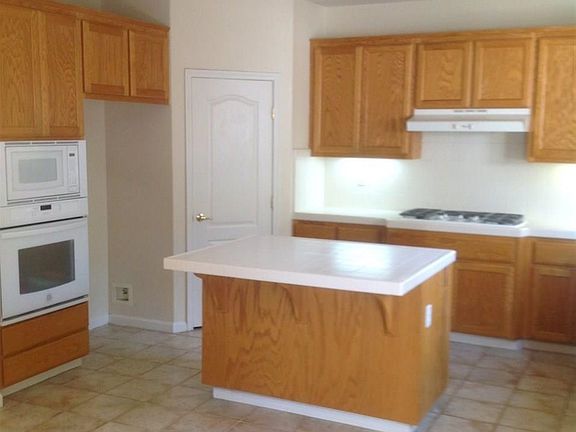 Newer Built in Microwave and Oven Close to the Island.