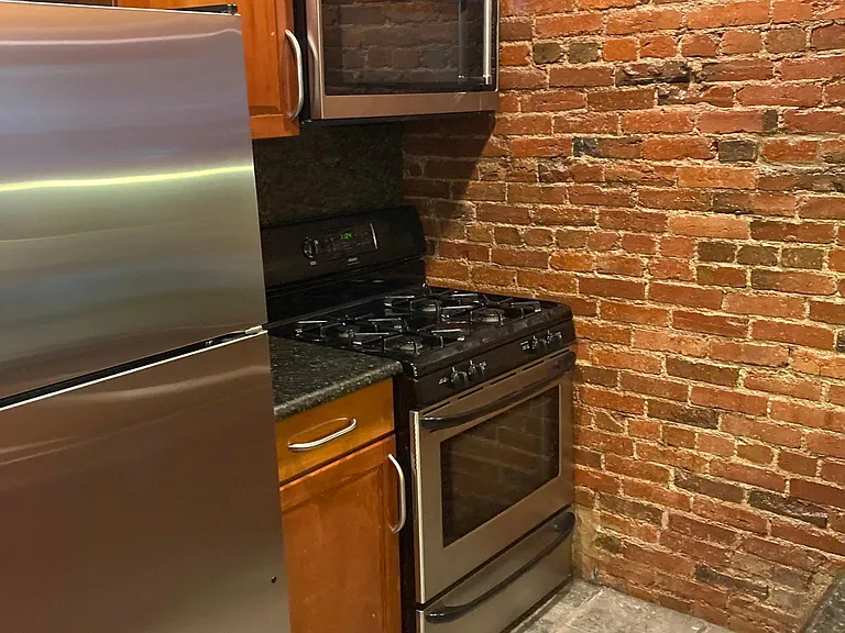 Kitchen w/gas range and microwave w/hood vent