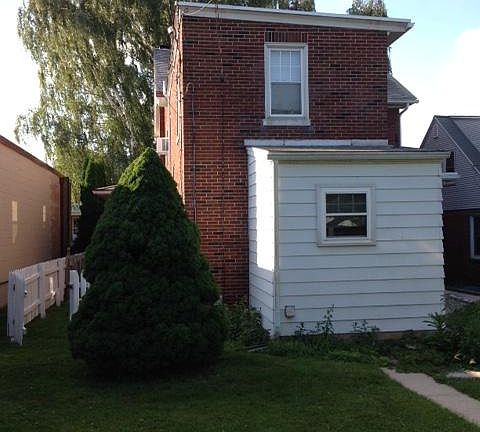 Back view... Bedroom 2nd fl , 3/4 bath/laundry 1st fl View of back side of apartment, bedroom 2nd fl window and 1st fl laundry/bath.