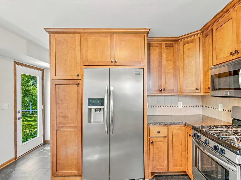 Water/ice on door of side by side refrigerator