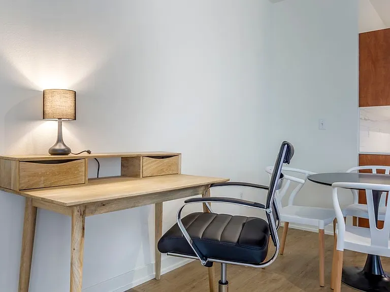 Furnished+ apartment homes include an office desk and chair (Representative Image exact items and style of furnishings may vary)