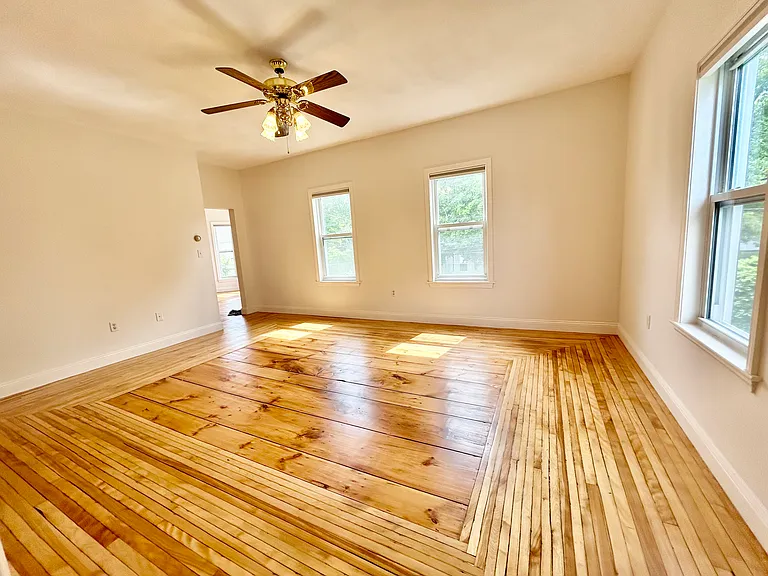 Living room with Hardwood flooring refinished