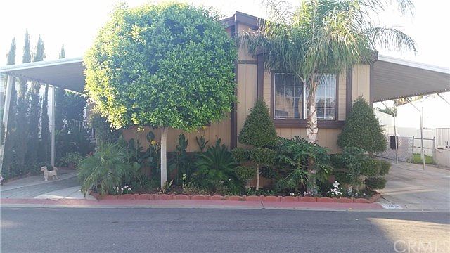 Front view of Home and Carports
