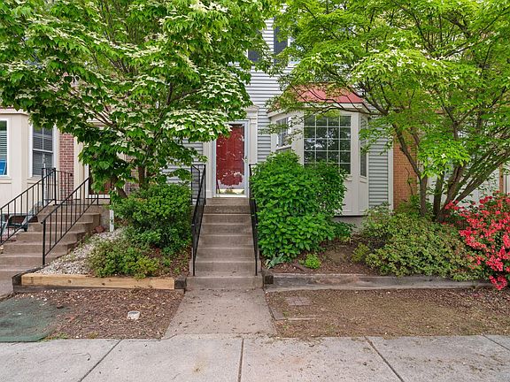 Front door framed by dogwoods