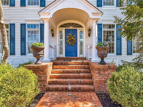 Charming front entrance to home with gorgeous landscaping