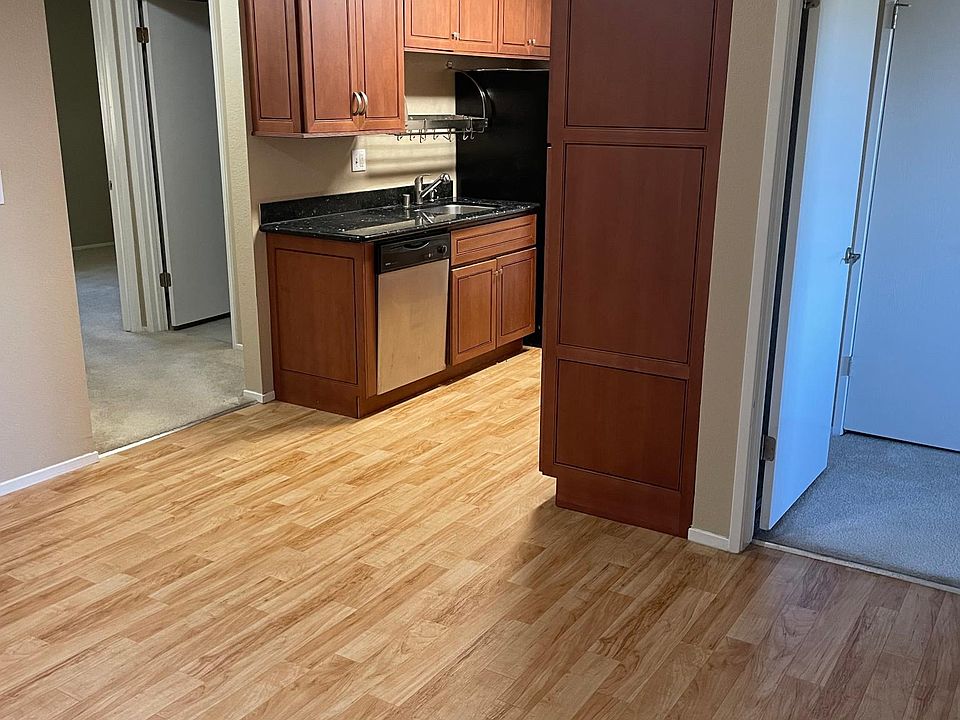 View of Dining, Kitchen, Master (Right Door) and 2nd Bedroom (Left Door)