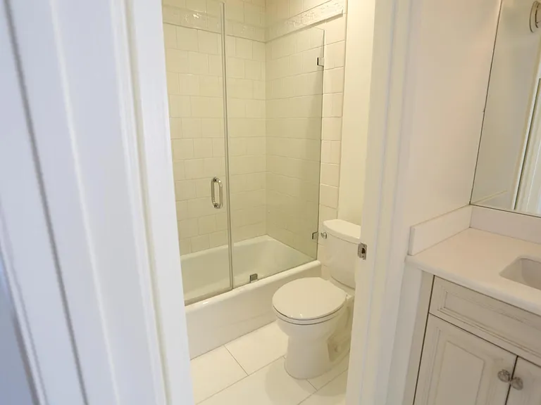 Closer view of bathroom and shower with tub