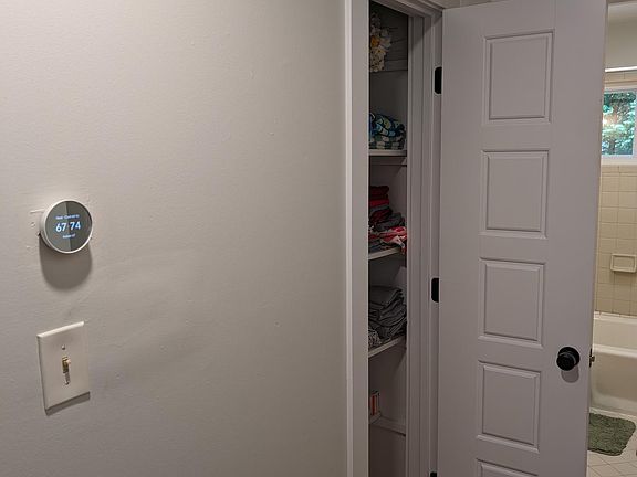Hall to linen closet, bathroom, second bedroom on the right