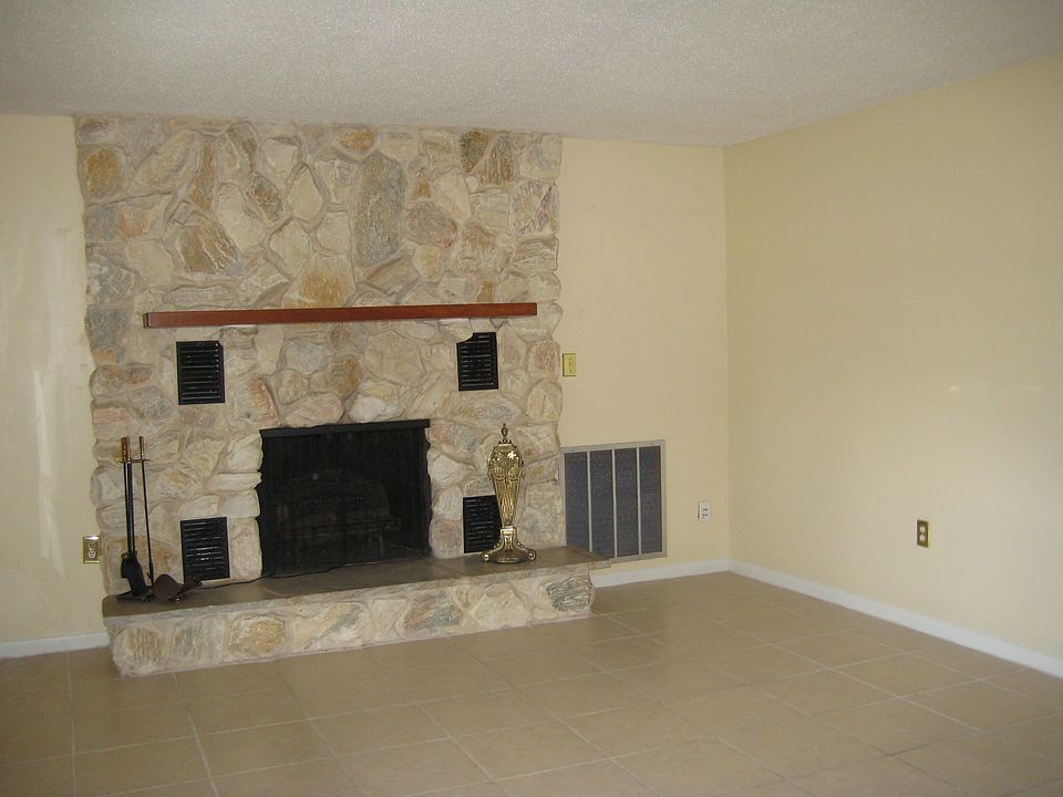 living room tiled with fireplace
