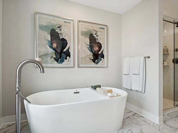 Soaker tub and glass shower in primary bath