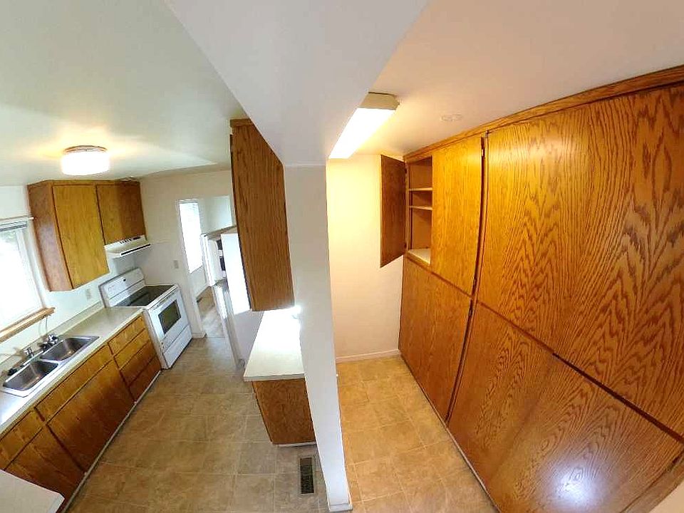 Kitchen and large pantry with deep shelves
