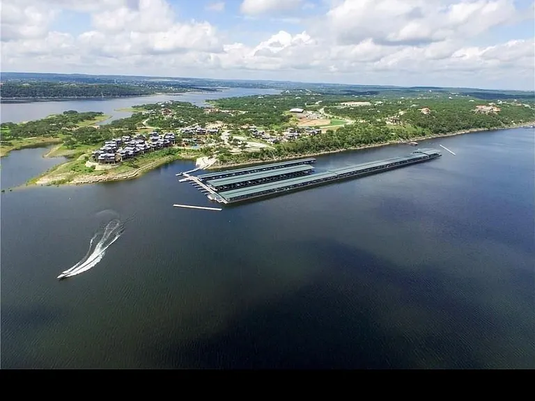 Marina at your disposal is located in the deepest part of Lake Travis. Treehouses are on far left of this photo.