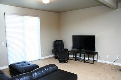This room is directly off kitchen at could be used as sitting area or dining area
