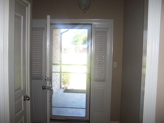 Front door leading to porch