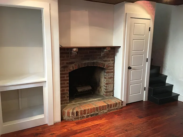 decorative fireplace on first floor.
