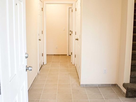 Front entrance with tile flooring. Laundry Area, Closet Stor