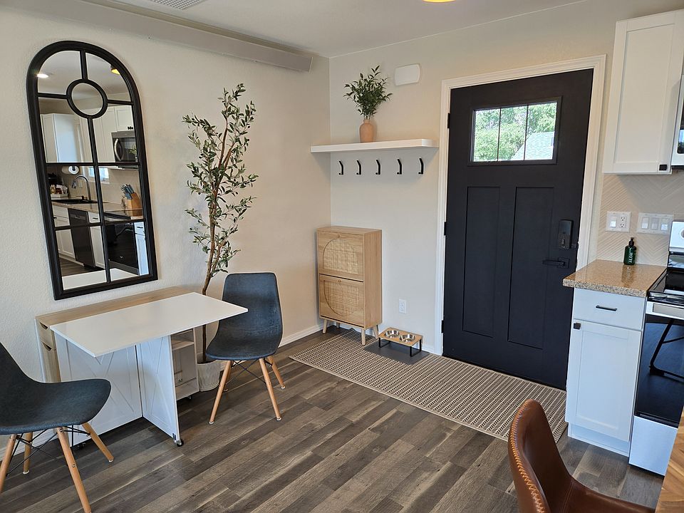 Front entrance with shoe storage and transition area with pull out kitchen table.