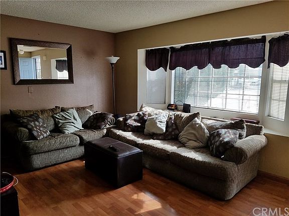Comfortable living room with large bay window..