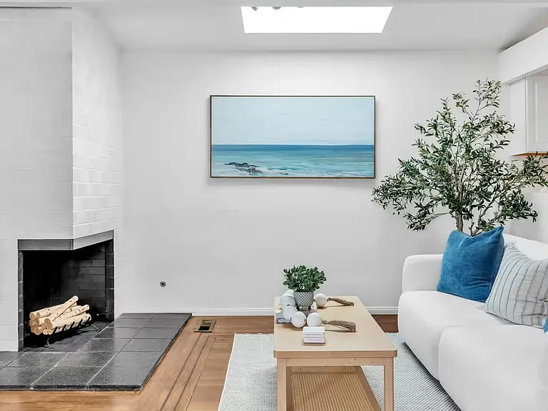 Cozy living room with a TV and a lovely fireplace