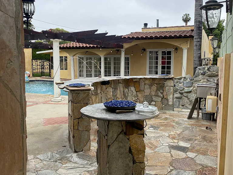 Custom barbecue area with water Sink and Natural gas for you grill as well as 
fire features on top