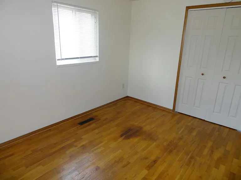 Good size second bed with two windows with blinds and large closet.