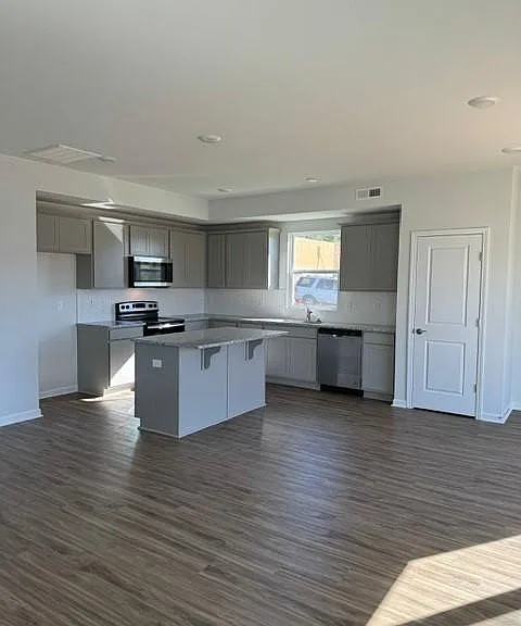 Open kitchen with a pantry. (Refrigerator to be included)