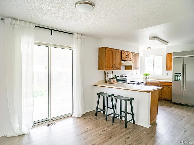 12812 E Wyoming Cir — Photo 3