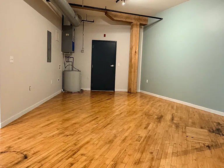 Entrance/Dining Area (Photos of similar unit with same floor plan. Unit 211 will have higher exposed beam ceilings. Colors, finishes, and fixtures may vary)