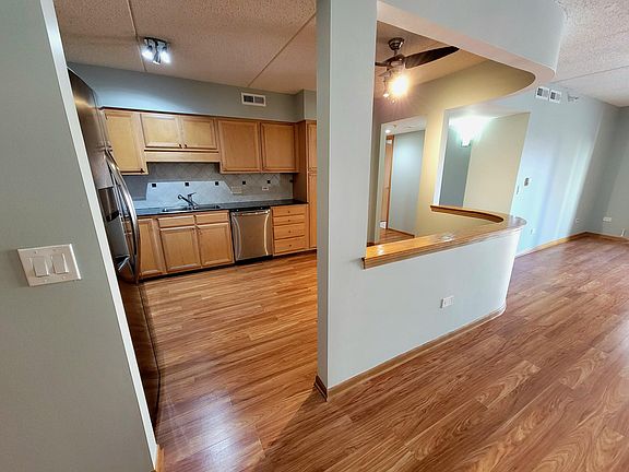 Kitchen - stainless steel appliances & maple cabinets