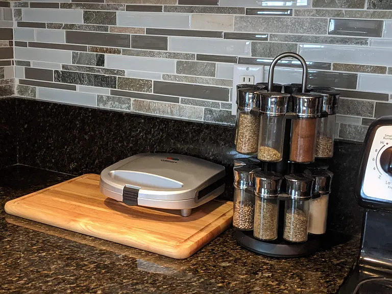 Kitchen Inventory, Granite counters and sleek backsplash