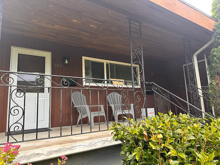 Enter on right side of front porch