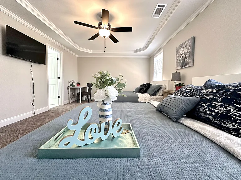 Large master bedroom with natural light