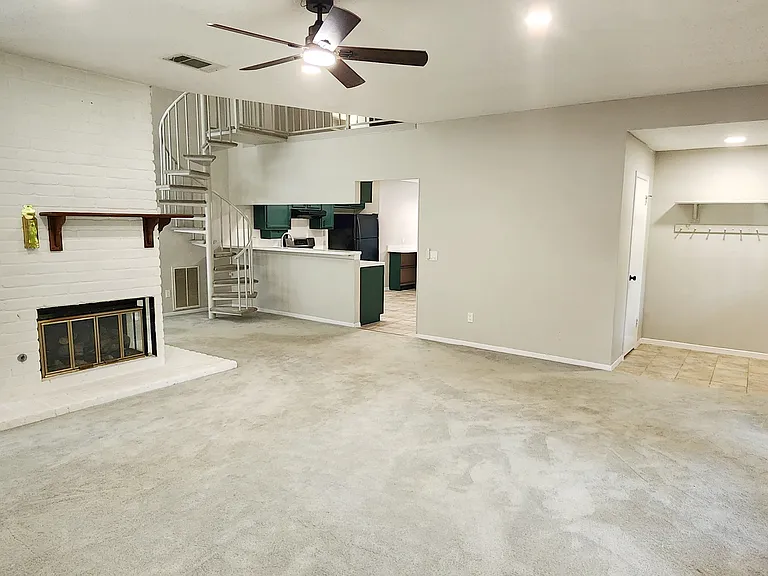 Living room with entryway & kitchen