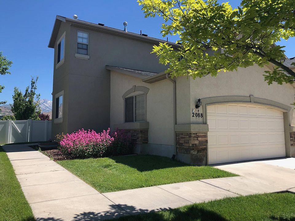 End unit townhome with two Bay garage. Front yard landscaping maintained by HOA.