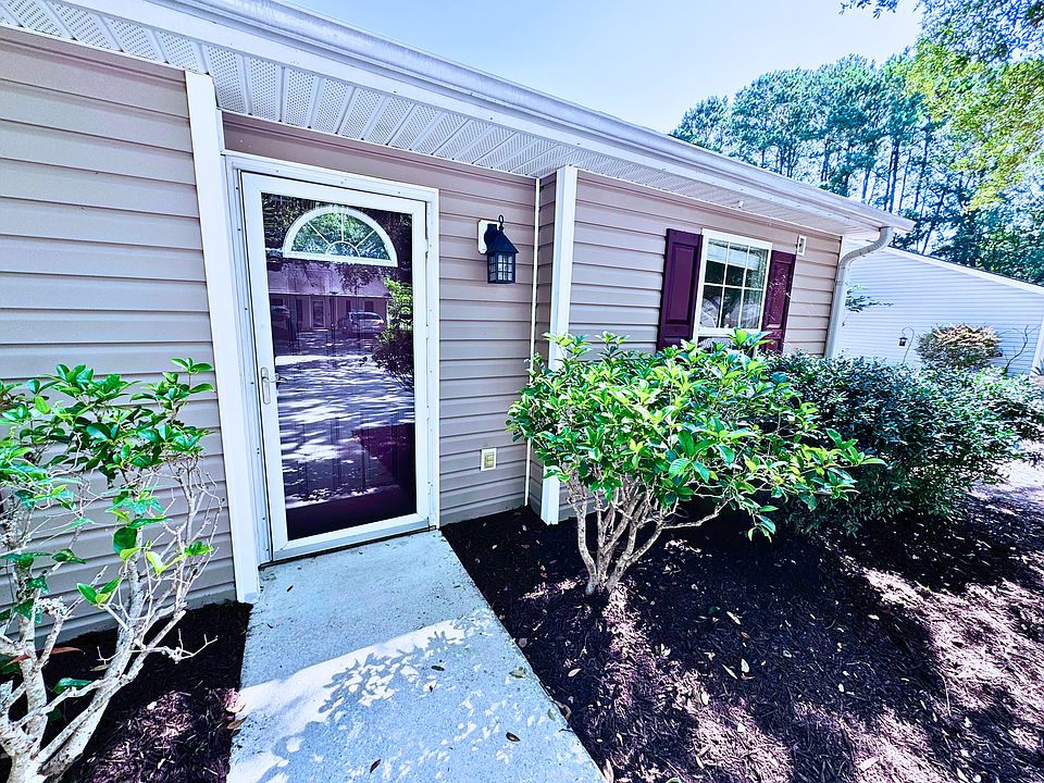 Freshly power washed exterior and freshened landscape.