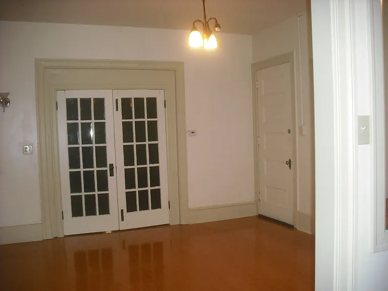 Living Room. Other side of French Door is the other bedroom.