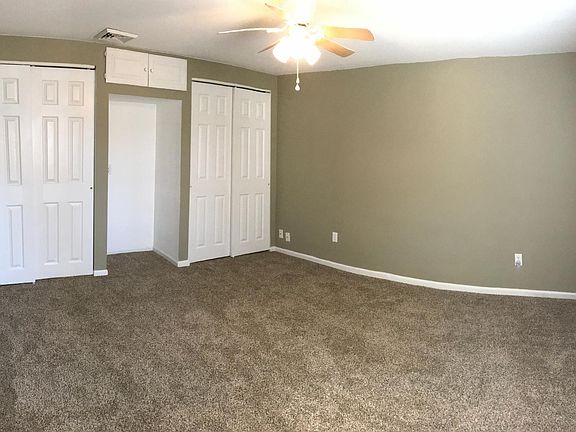 Spacious bedroom with 2 closets and ceiling fan