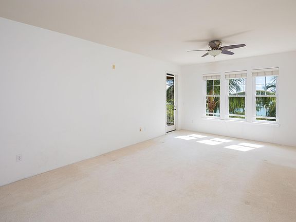 Large Great Room for Living and Dining has Marina View and access to the Covered Lanai.