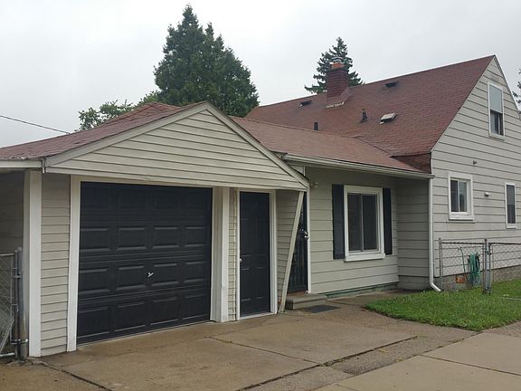 Roof replaced and now dark grey.